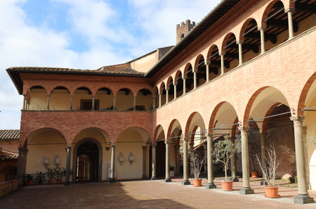Siena, SI, Italy - February 20, 2023: Ancient cloister of the convent of the Basilica of San Domenicoのeditorial素材