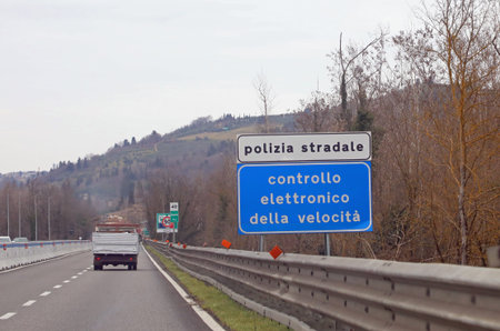 Siena, SI, Italy - February 21, 2023: Italy Warning Panel that means Police Speed Check in the...