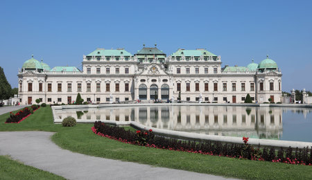 Vienna, WIEN, Austria - August 22, 2023: Belvedere Castle and little lake with flowersのeditorial素材