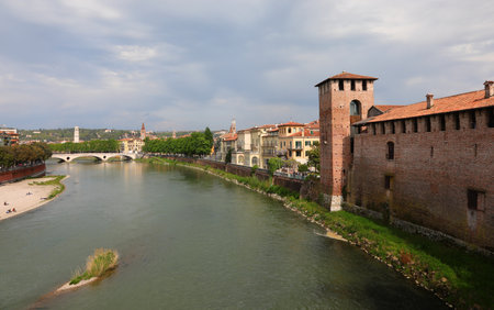 Verona, VR, Italy - April 23, 2023: River called ADIGE and Ancient Palace in Veneto Regionのeditorial素材