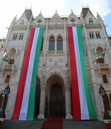 Budapest, B, Hungary - August 20, 2023: Hungarian Parliament building and big flags during the National Dayのeditorial素材