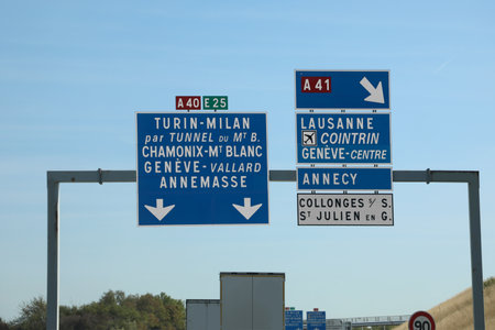 road sign on the border between Italy and France and indications for the tunnel under Mont Blancの写真素材