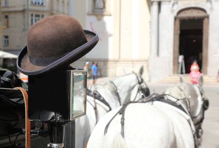 bowler hat of the coachman who takes tourists around the city in his carriageの写真素材