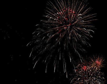 Colorful fireworks show with colorful explosions in the night during the national celebrationの写真素材