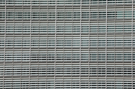 Brussels, B, Belgium - August 18, 2022: background of many windows of the modern building in the...