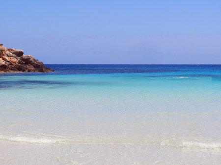 Caribbean panorama with water of many shades of blue and turquoise and the beach with clear sandの写真素材