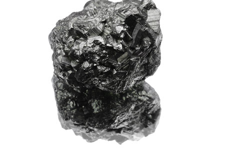 small gray shiny metallic nugget just found by searchers on the white background