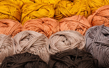 background of colorful multicolored balls of thread for DIY clothing creations on sale in the Yarn...