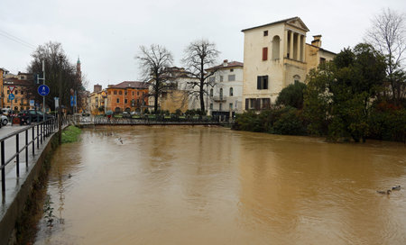 river called FIUME RETRONE in Vicenza City in northern Italy during flood in winterの写真素材