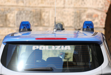 Rome, RM, Italy - June 2, 2024: police car with blue flahing sirens and text POLIZIAのeditorial素材