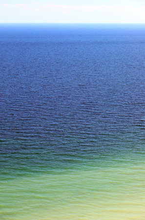 incredible shades of blue in the sea making it an ideal background for summer vacationsの写真素材