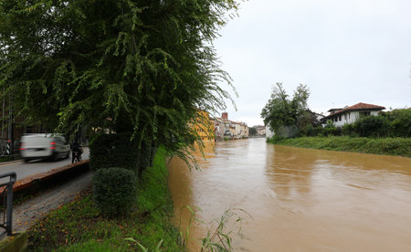 Bacchiglione river in the city of vicenza north italy flooded after heavy rains from climate changeの写真素材