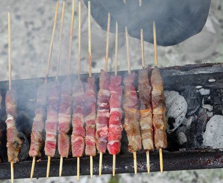 many skewers of lamb and mutton grilled and smoked, called ARROSTICINI in Italianの写真素材