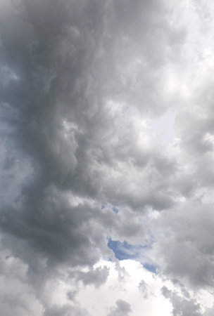 huge black and gray cloud developing vertically threatening impending rain