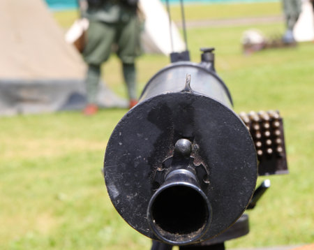 detail of the black barrel of the machine gun used by soldiers during the First World War to defend the borderの写真素材