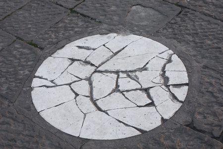 white stone circle marking spot where golden ball fell from florence duomo dome in italyの写真素材