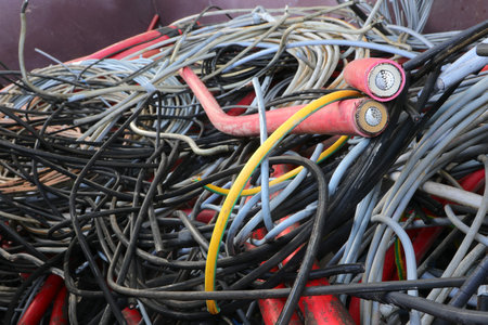 detail of the old copper cables in the recycling center to proceed with the disposal and recovery of the precious mineralの写真素材