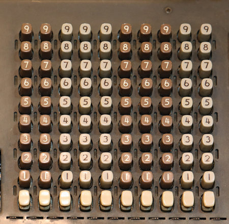 very old keyboard of an old cash register with many numbers and pulses to press