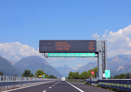 large portal with illuminated messages on the motorway and the system for detecting traffic offenses for speedingの写真素材