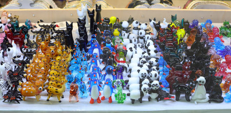 Venezia, VE, Italy - May 6, 2025: many small animals in murano glass for sale in the venetian storeの写真素材
