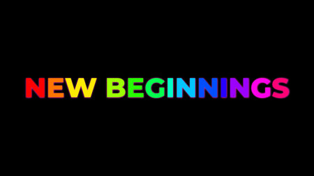 Big Text NEW BEGINNINGS with randomly colored letters with colors of the rainbow on black backgroundの写真素材