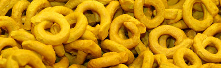 small breadstick in toroidal shape baked in three oven called TARALLI or TARALLINI in Italian...