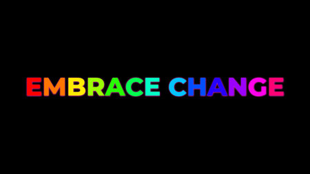 Big Text EMBRACE CHANGE with randomly colored letters with colors of the rainbow on black backgroundの写真素材