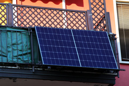 modern photovoltaic panel with particular installation on the railing of a terrace in the condominium to have clean and sustainable energy from the sunの写真素材