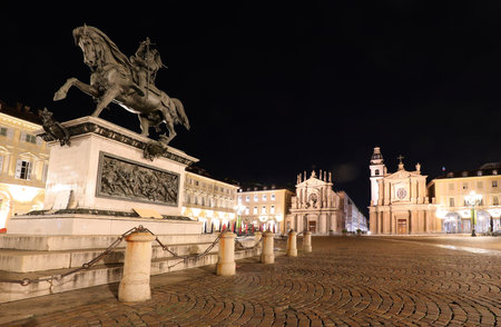 equestrian statue and twin Churches in the wide square called Piazza San Carlo in Turin City in Northern Italyの写真素材