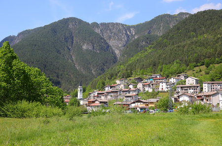 Small Village called Slizza di Resia in Northern Italy with houses and churchの写真素材
