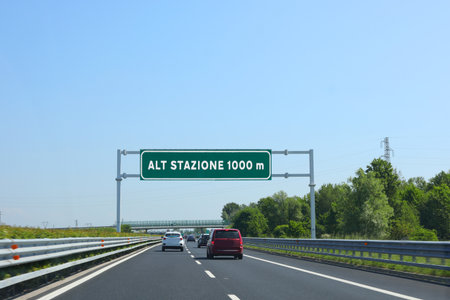 BIG Road signal with text ALT STAZIONE tha means STOP At TOLL booth station at 1000 meters in italian languageの写真素材