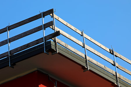 wooden board parapet installed along the roof frame for protection against falls during maintenance of the condominium roofの写真素材