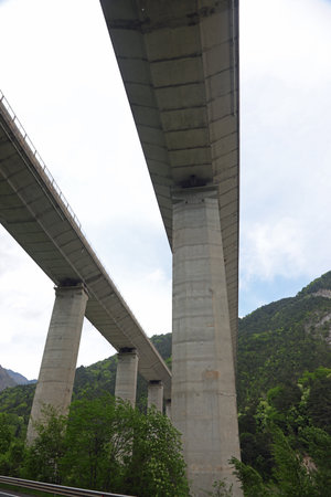 view from under the Highest pylons of reinforced concrete to support the highway that runs very highの写真素材