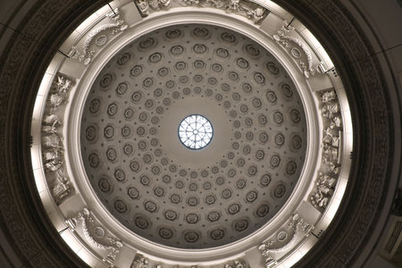 Coffered concrete dome of the Gran Madre di Dio church in Turin with an oculus, a circular opening in the center of the dome that allows one to admire the skyの写真素材