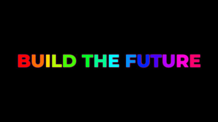 Big Text BUILD THE FUTURE with randomly colored letters with colors of the rainbow on black backgroundの写真素材