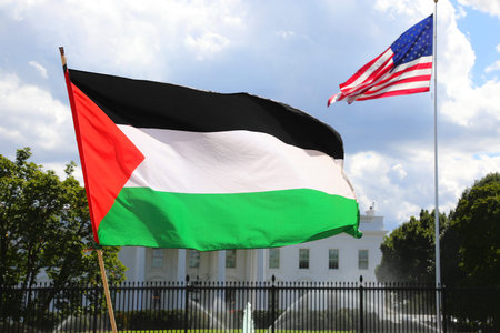 Large Palestinian and American flags during the protest demonstration in front of the White House in...