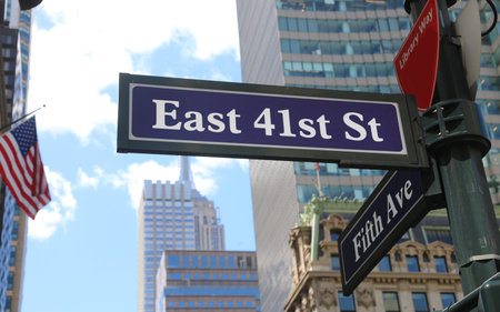 clear street sign showing directions for East 41st Street and Fifth Avenue in New York City