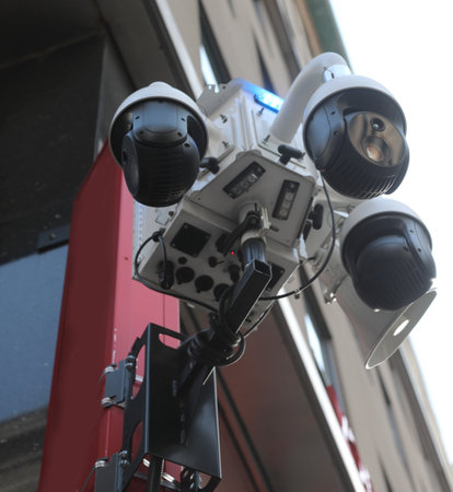 Many modern surveillance cameras monitoring city people linked to police centerの写真素材