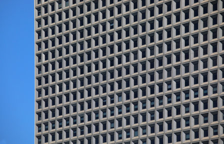 Sky and skyscraper with very many uniform square windows in the financial districtの写真素材