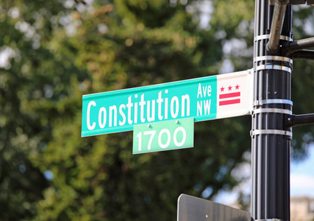 road sign for constitution avenue northwest at number seventeen hundred in washington dc usaの写真素材