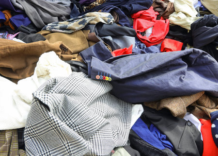 stall with many good quality used clothes scattered loosely at the secondhand marketの写真素材