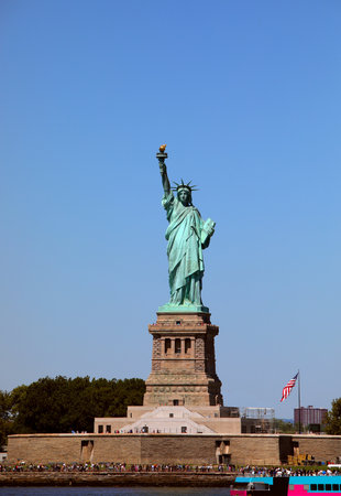 lady liberty icon of liberty and us ideals new york harbor and the passenger ferry vesselの写真素材