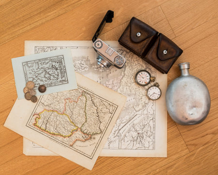 old map on table with old coins of distant and exotic states. memories of unforgettable adventures.