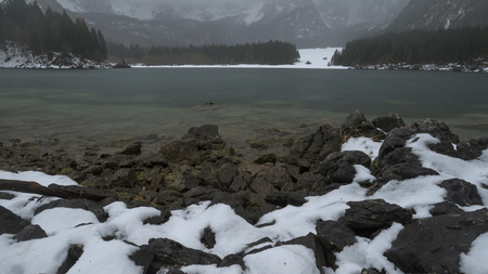 lakes of fusine, 12/11/2017 - lakes of fusine after an intense snowfall, a white snow creates a magical atmosphere. The unique landscape of the Alps.のeditorial素材