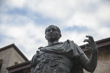 Cividale del Friuli, Italy / Cividale, 01/13/2018 : Photo of a statue of Julius Caesar in the foreground, in the background the sky with clouds. the statue is at a park in cividale del friuli (UD, Udine, Italy, friuli venezia giuli, FVG).のeditorial素材