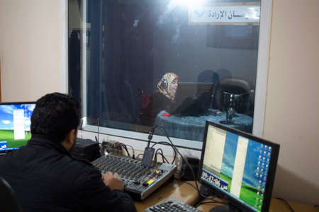 Gaza Strip, Gaza City: a radio station hires boys who have been injured by the bombingのeditorial素材