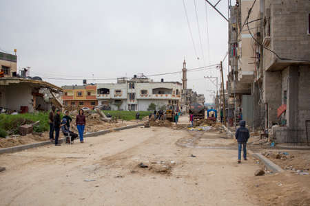 Gaza Strip, children play and live on the street amidst the rubble after the bombingsのeditorial素材