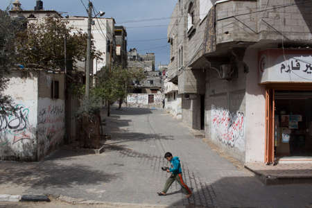 Gaza Strip, children play and live on the street amidst the rubble after the bombingsのeditorial素材