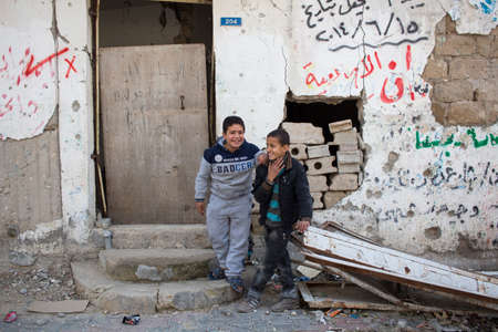 Gaza Strip, children play and live on the street amidst the rubble after the bombingsのeditorial素材