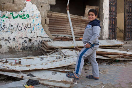 Gaza Strip, children play and live on the street amidst the rubble after the bombingsのeditorial素材
